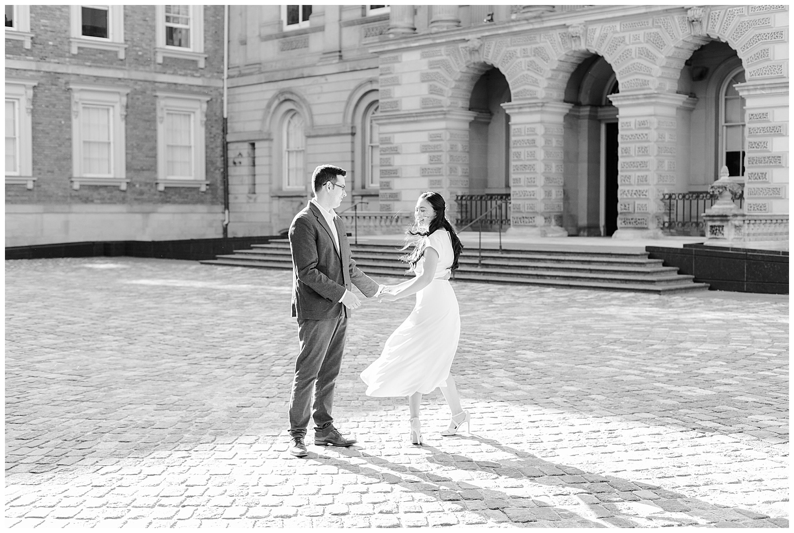 Osgoode Hall Summer Engagement Session - Couple dancing at Osgoode Hall